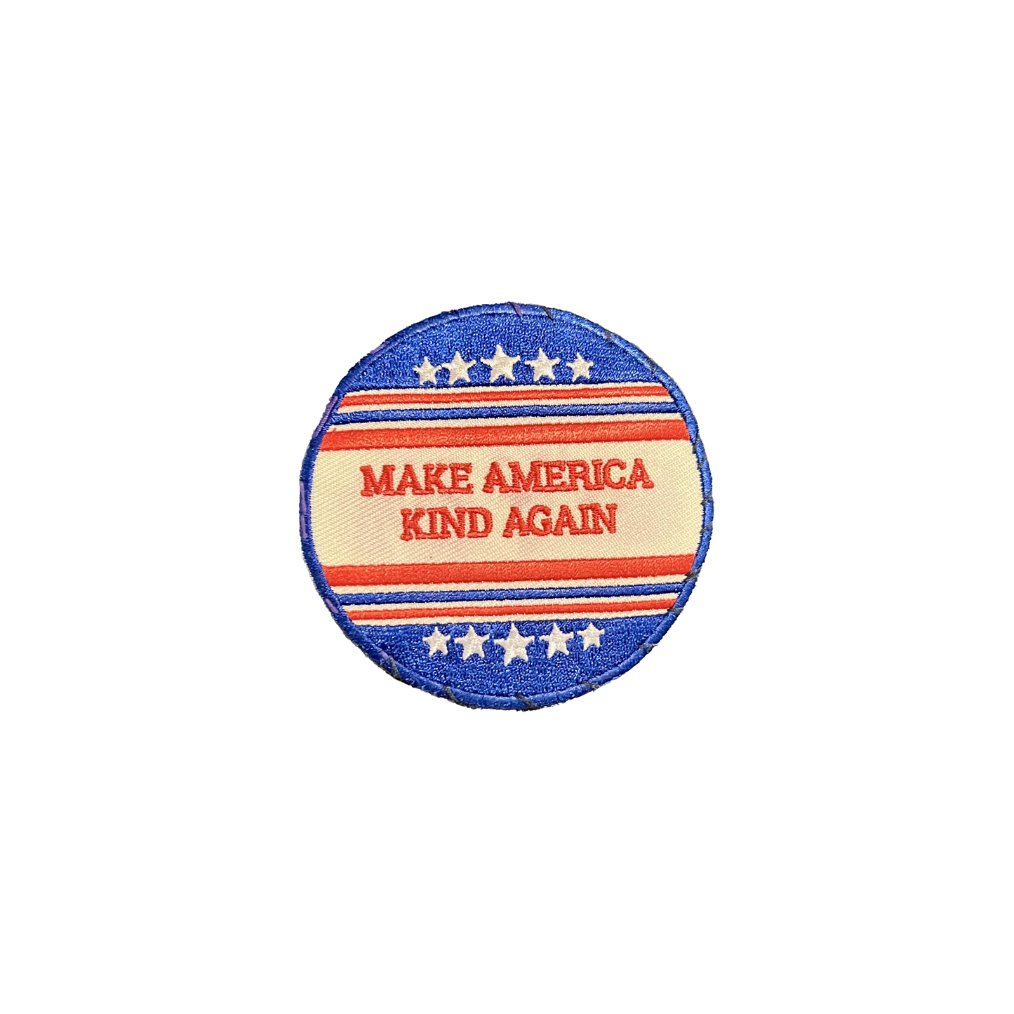 Circular embroidered patch reading “MAKE AMERICA KIND AGAIN” in red text, framed by red, white, and blue stripes and stars — a soft, subversive take on political iconography.