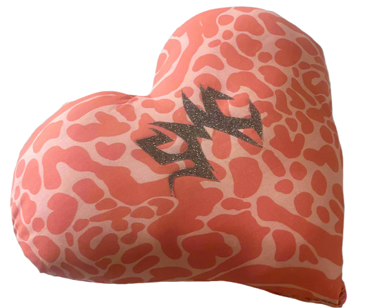 One-of-a-kind heart-shaped SMC pillow featuring a bold two-tone pink animal print pattern and adorned with the sparkly silver SMC sigil — a handmade artifact from the Secret Mystic Collection.
